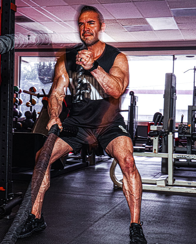 male working out in the gym in animal apparel